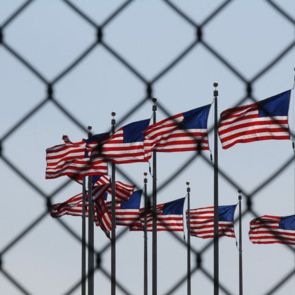 American flags behind a fence