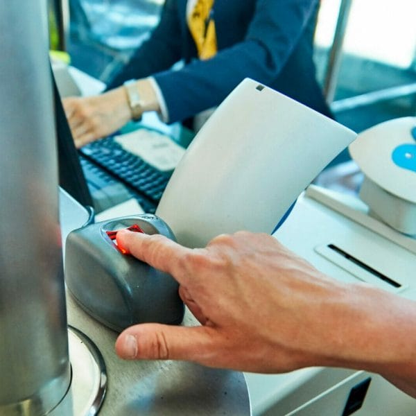 Immigrant has their biometrics taken by USCIS