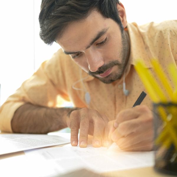A new immigrant works on his resume