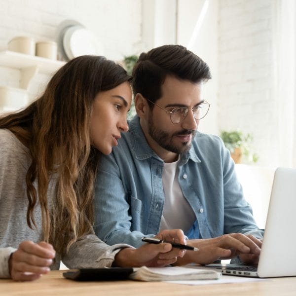 Immigrant couple works on their finances.