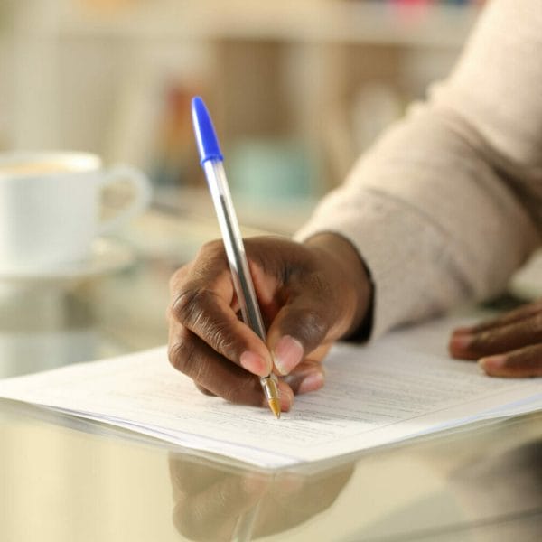 Person filling out Form I-130