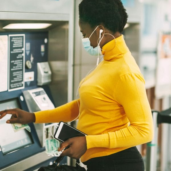 An immigrant getting cash from an ATM