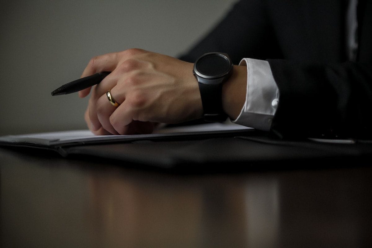 Immigration Lawyer with a Pen and Notepad