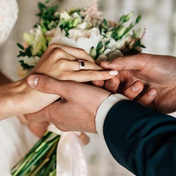 Immigrants marrying in a courthouse wedding.