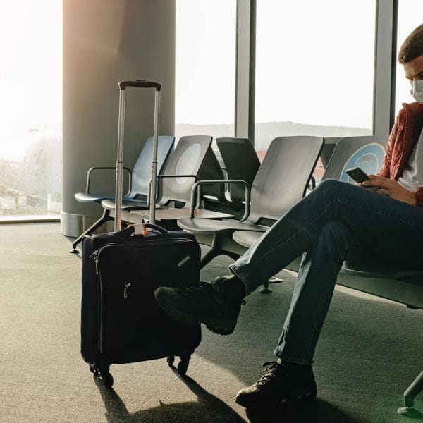 Traveler with covid mask at the airport