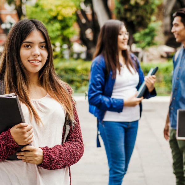DACA student stands with friends
