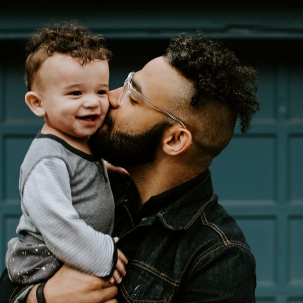 Man hugs his son
